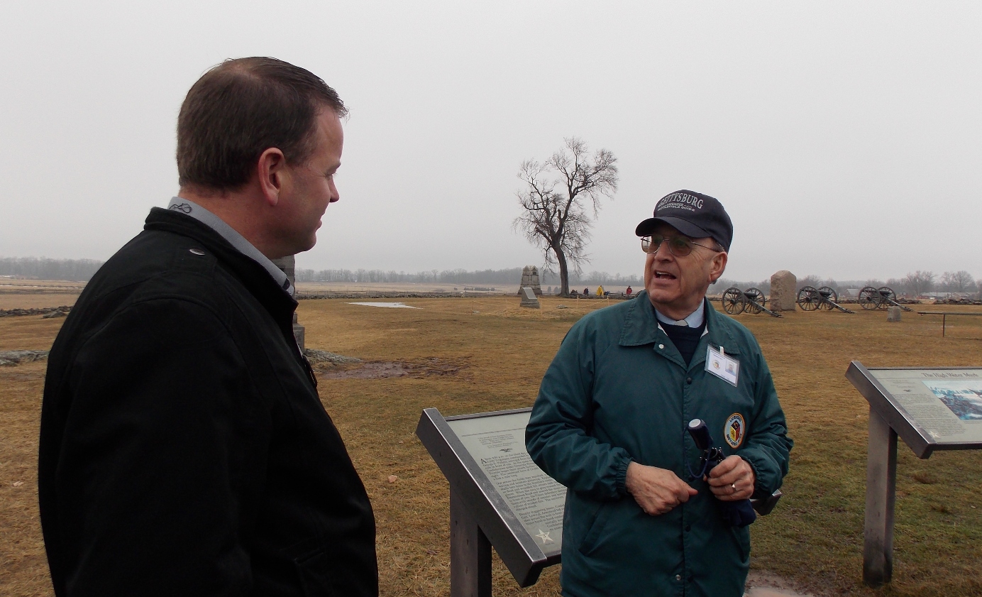 David Jansen talks with tour guide Terry Fox during the Gettysburg battlefield tour.