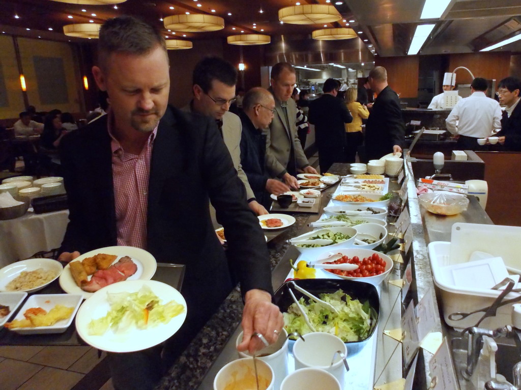 Kirk Liefer, left, samples several Japanese cuisine options during our first dinner in Tokyo, at the hotel buffet.