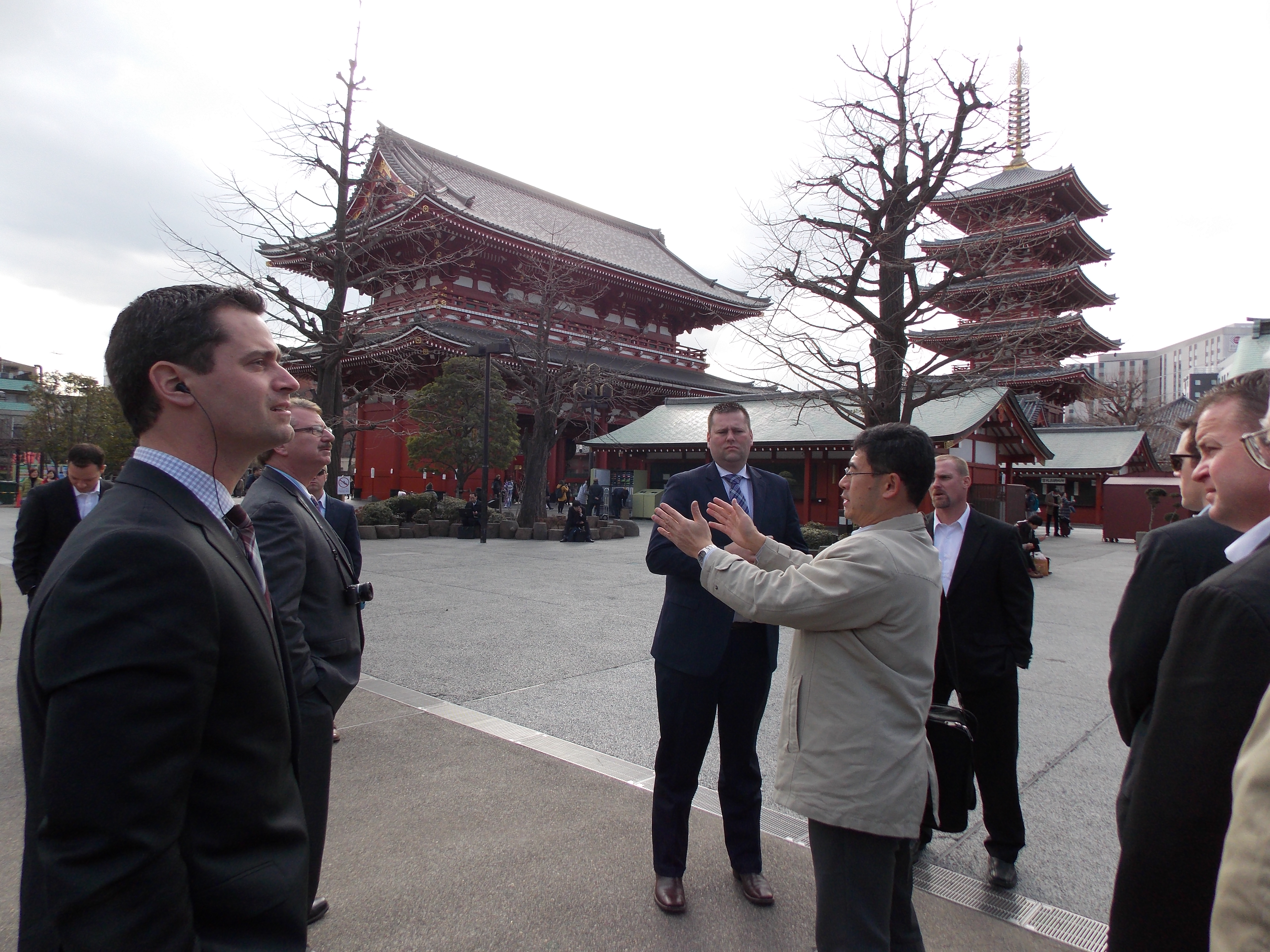 Katsumi Niwa-san, the English-speaking guide who has been with us all week, explains the customs and history of the Buddhist Sensoji Temple.